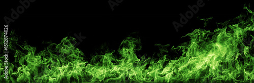 Intense green fire flames burning brightly against a dark black background