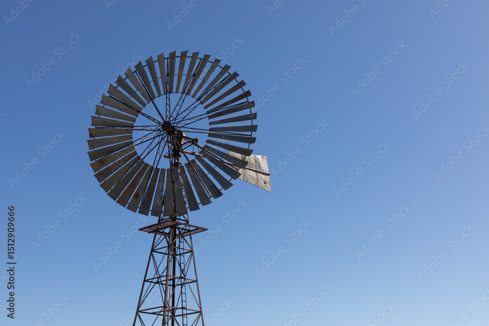 Large windmill used to pump ground water for stock. Large windmill used to pump ground water for stock.