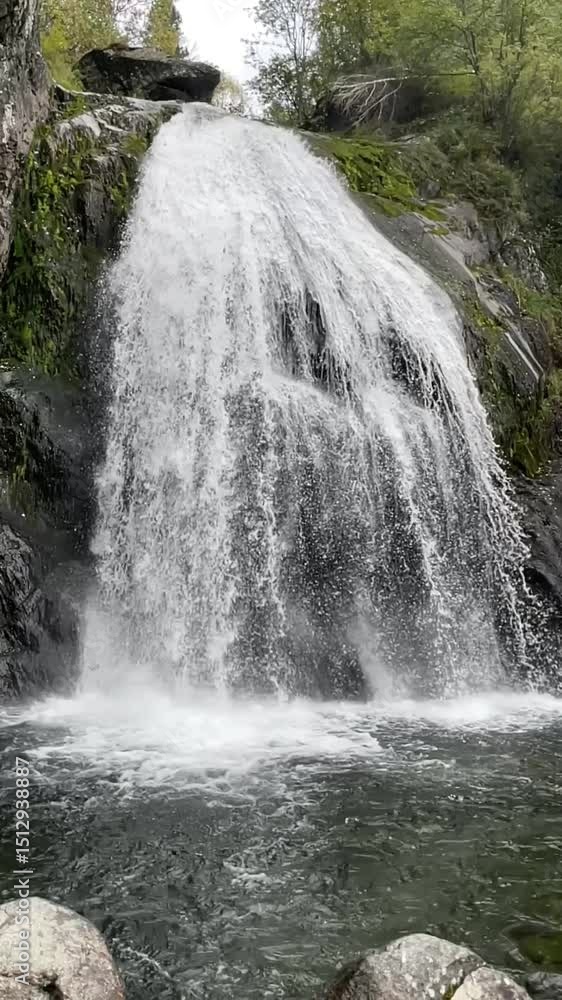 Korbu waterfall near Teletskoye lake in Altai Russia. Powerful stream of water falling from cliff surrounded by wild forest. High quality 4k footage Korbu waterfall near Teletskoye lake in Altai Russia. Powerful stream of water falling from cliff surrounded by wild forest. High quality 4k footage