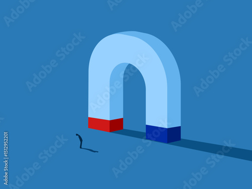 Motivation, Businessman standing looking at large magnet
