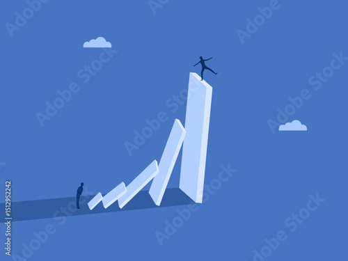 Businessman on a falling domino