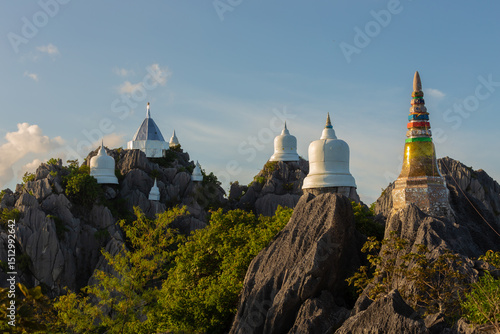Wat Chaloem Phrakiat Phra Chom Klao Rachanusorn. This temple has small white pagodas lined up on the top of the mountain. It is also the site of the Buddha's footprint in Chae Hom District, Lampang