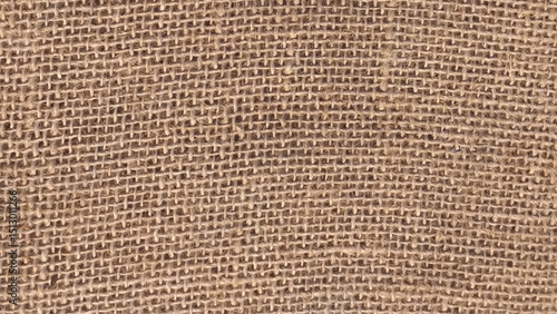 Rough burlap texture, canvas coarse cloth, dark brown woven rustic bagging. Natural hessian jute, beige textile texture. Linen fabric pattern. Threads background. Sackcloth surface, sacking material.