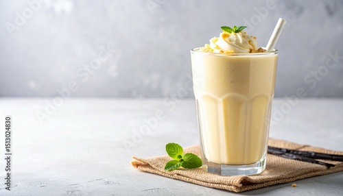 Vanilla smoothies with vanilla ice cream and simple garnish and biscuit crumble
