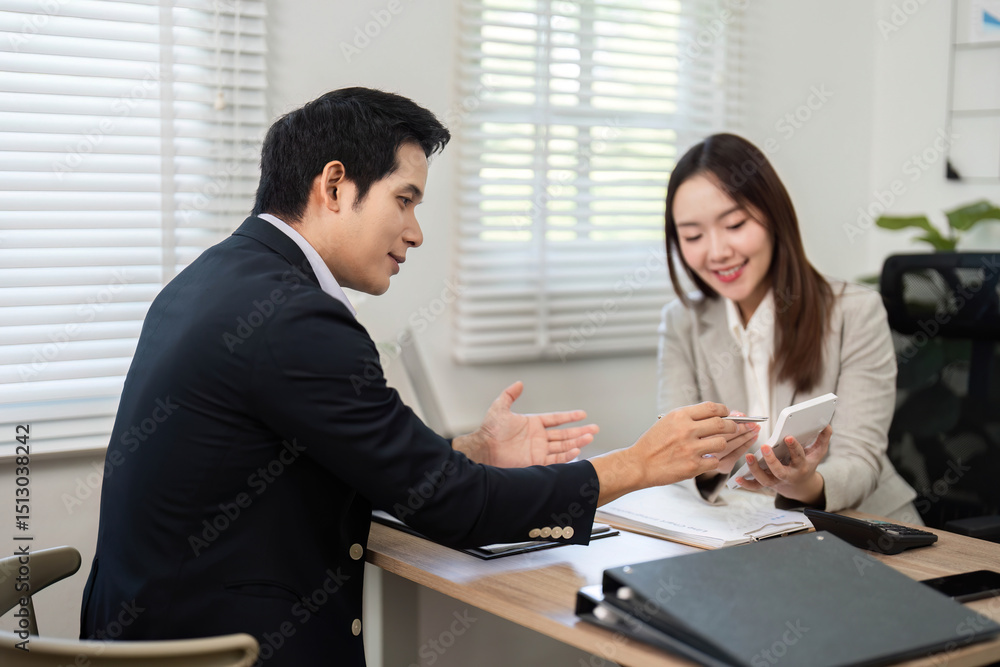 Financial Consultation. Advisor explaining investment strategies to a client in a modern office. Financial Consultation. Advisor explaining investment strategies to a client in a modern office.