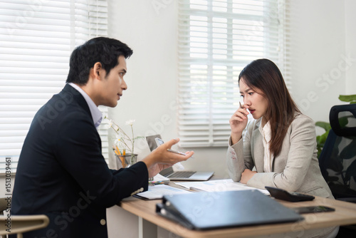 Wallpaper Mural Financial Consultation. Professional discussion between a financial advisor and a client in an office. Torontodigital.ca
