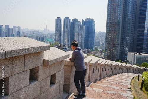 Photography Man standing on Stone Stair at Baekbeom Plaza in Seoul, South Korea - 韓国 ソウル 白凡広