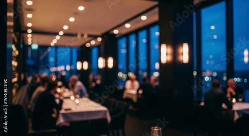 Blurred scene of a high end restaurant interior with patrons and city lights at evening