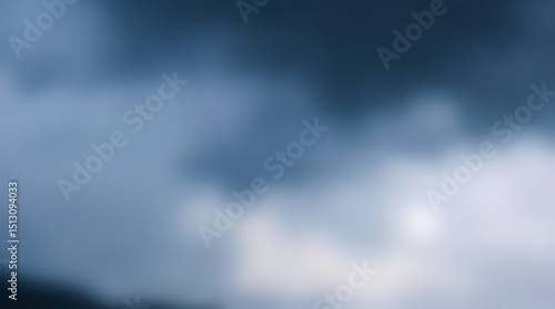 Soft-focus, out-of-focus view of dark and light blue-gray clouds