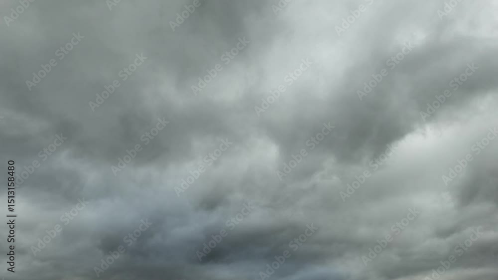 Bluish stratocumulus clouds moving across the sky at sunset Bluish stratocumulus clouds moving across the sky at sunset