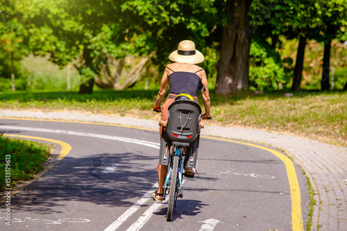 Wallpaper Mural Cyclist ride on the bike path in the city Park Torontodigital.ca