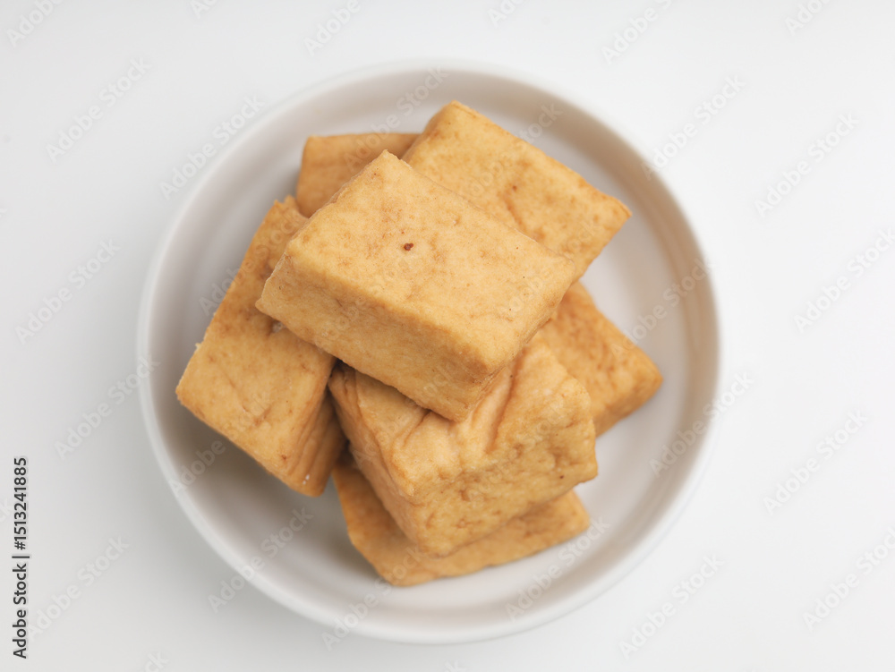 Tofu on a plate, on white background Tofu on a plate, on white background