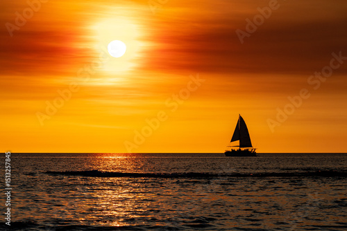 Sailboat on the sea at sunset 