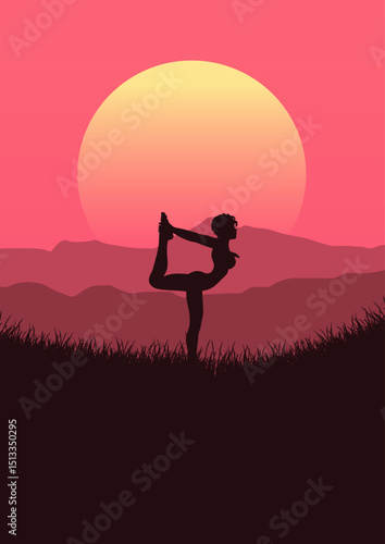 Silhouette of a female in a standing yoga pose in sunset landscape 