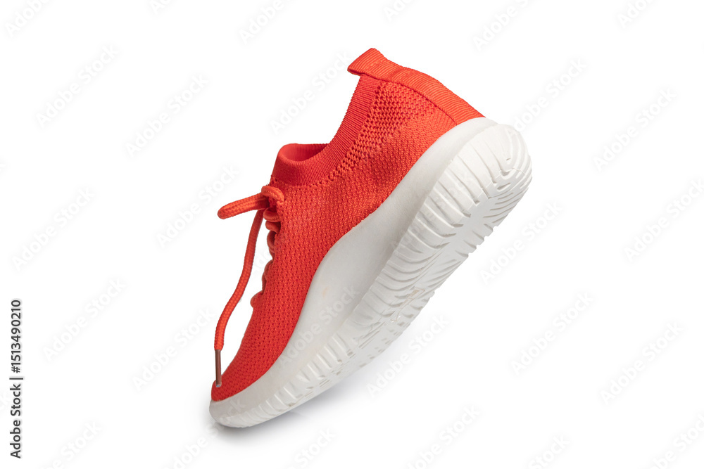 Fototapeta premium Orange sneakers isolated on white background – vibrant athletic shoes