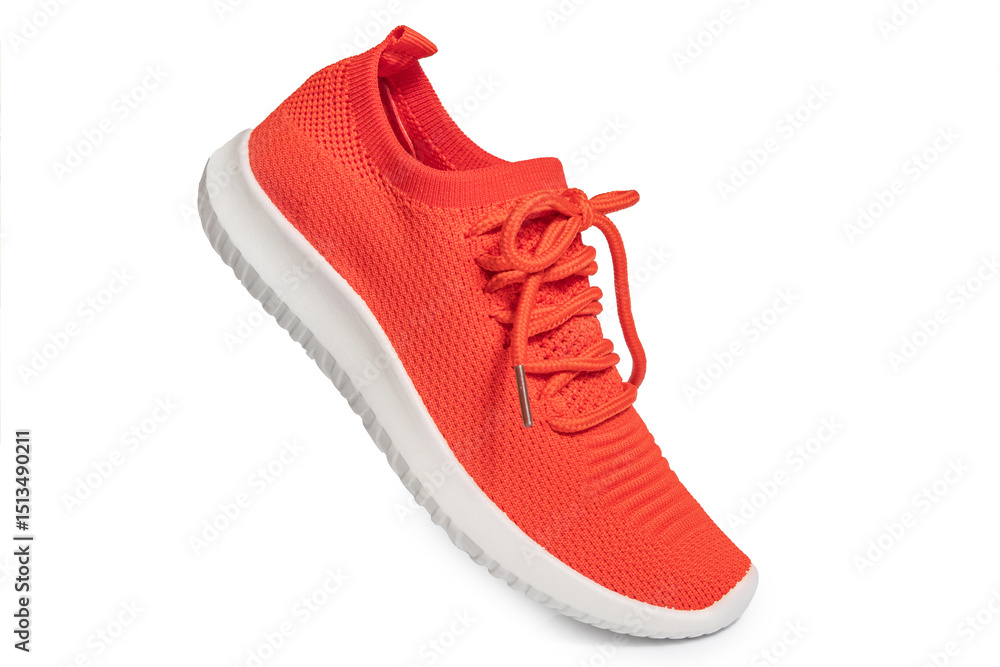 Fototapeta premium Orange sneakers isolated on white background – vibrant athletic shoes