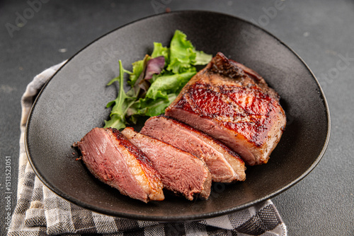 Duck breast roast meat poultry fresh delicious gourmet food background on the table rustic food top view copy space
