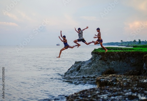 Rural South asian Boys Jumping into the River for a Playful Summer Swim