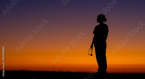 Silhouette of a Healthcare Professional at Sunset Contemplation and Resilience