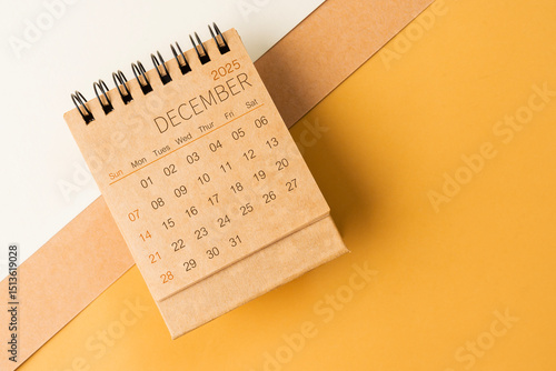 Wallpaper Mural Blank desk calendar for December 2025 on brown tone background. Torontodigital.ca