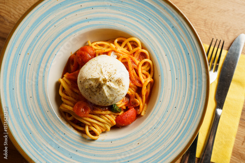Spaghetti with tomato sauce and burrata cheese