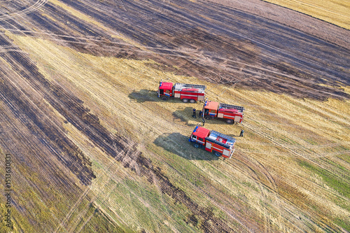 Three rescue vehicles arrived on an urgent call to extinguish a fire in a grain field