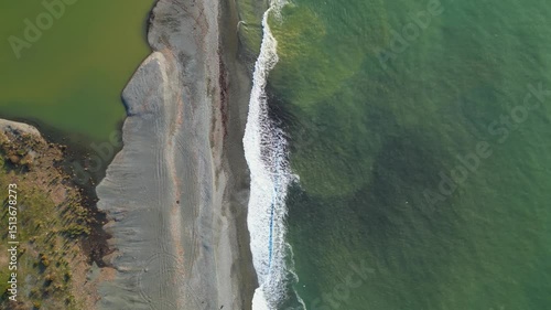 Discover an enchanting landscape along the Adjara coastline in Georgia, where the vibrant river flows into the vast Black Sea, intricately shaping the shoreline.