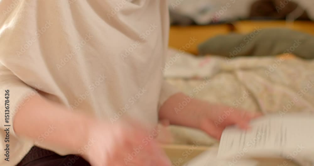 A woman is comfortably seated on a neatly made bed, holding and deeply reading a heartfelt letter, reflecting on its contents in a cozy and warm bedroom setting that feels inviting A woman is comfortably seated on a neatly made bed, holding and deeply reading a heartfelt letter, reflecting on its contents in a cozy and warm bedroom setting that feels inviting