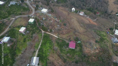 Witness a breathtaking sunset illuminating Batumi's skyline, reflecting vibrant colors over houses and mountains in Adjara. Nature and urban life beautifully merge in this picturesque view.