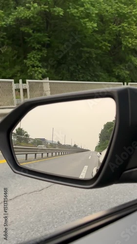 Scenic countryside drive reflected in side mirror on a quiet road -2