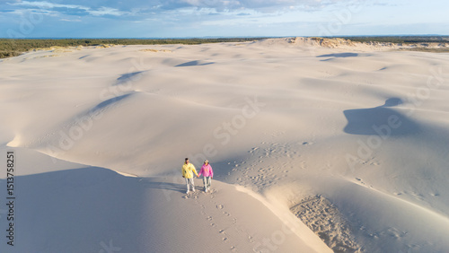Картината върху платно Exploring the serene sand dunes of Denmark with a partner on a sunny day
