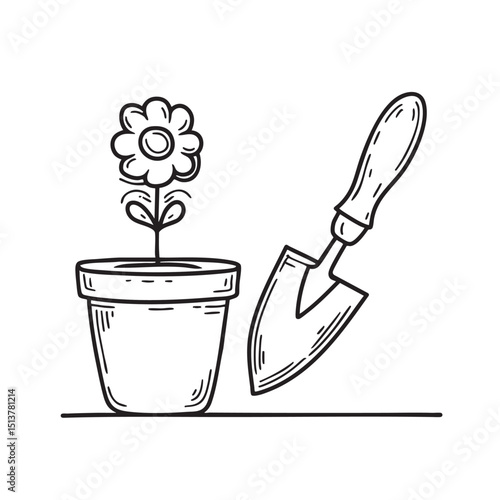 A trowel lying near a flower pot