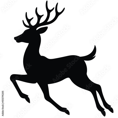A deer with large antlers runs quickly through a natural landscape.