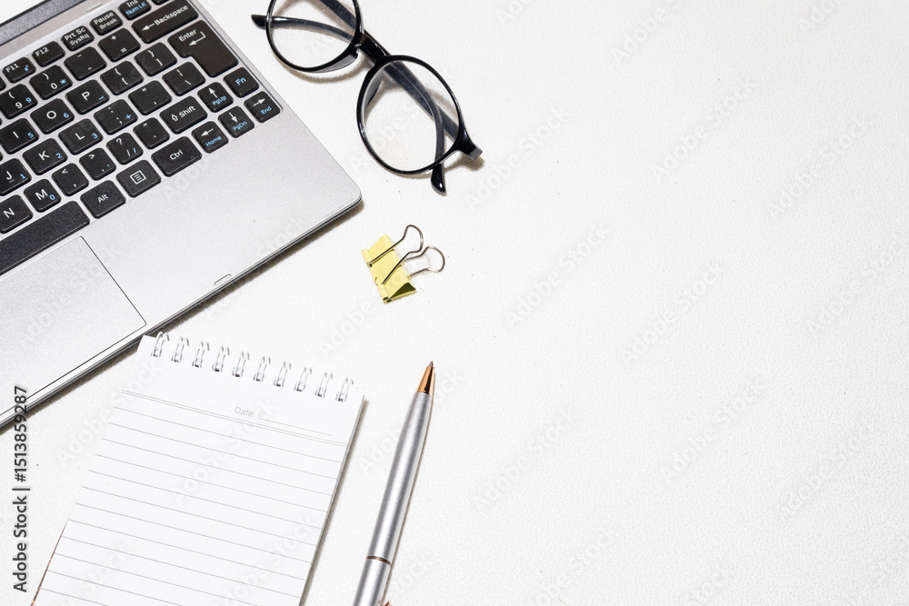 Top-Down View of Creative Workspace – Laptop and Office Accessories on White Desk Top-Down View of Creative Workspace – Laptop and Office Accessories on White Desk