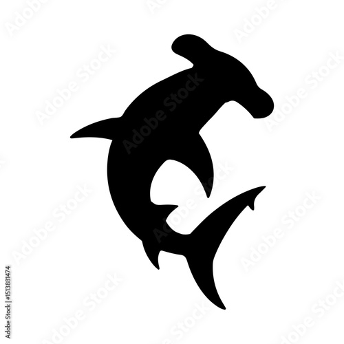 Silhouette of a hammerhead shark swimming gracefully in the ocean water with its unique head shape shown