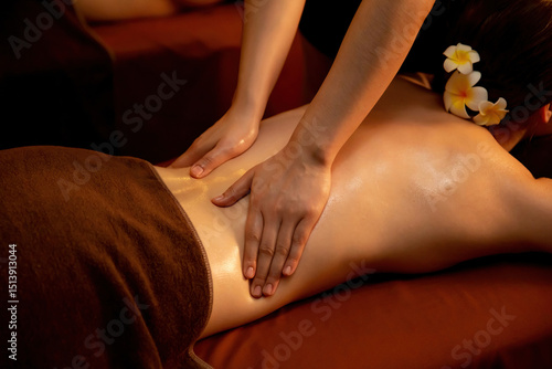 Wallpaper Mural Caucasian woman customer enjoying relaxing anti-stress spa massage and pampering with beauty skin recreation leisure in warm candle lighting ambient salon spa at luxury resort or hotel. Quiescent Torontodigital.ca