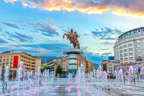 Skopje city center. Square Macedonia at sunset with dancing illuminated fountains and statue of Alexander the Great (Warrior on Horse) at background.