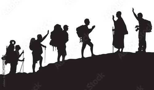 Silhouetted Group of Hikers Walking Together on Mountain Ridge