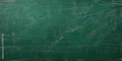Abstract texture of green chalkboard background texture with copy space. Design concept for school education, dark wall backdrop , design template.	