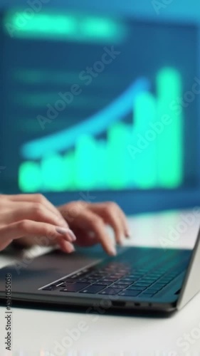 woman typing on laptop working at office wilh a tablet laptop and writing