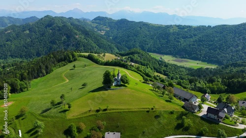 A church on the sunny hill, Slovenia, Sv. Tomaž, drone video, aerial footage