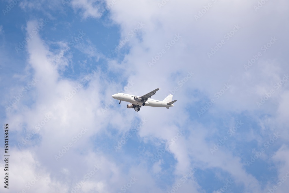 Passengers commercial airplane flying above clouds. Airplane in the sky, over the cloudy sky Passengers commercial airplane flying above clouds. Airplane in the sky, over the cloudy sky