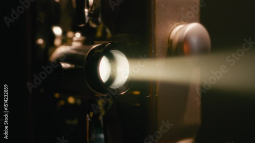 Old Film Projector With Lens Emitting Bright Light