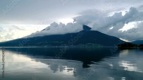Mountain View Reflected in Calm Lake Under Cloudy Sky Scenic Landscape