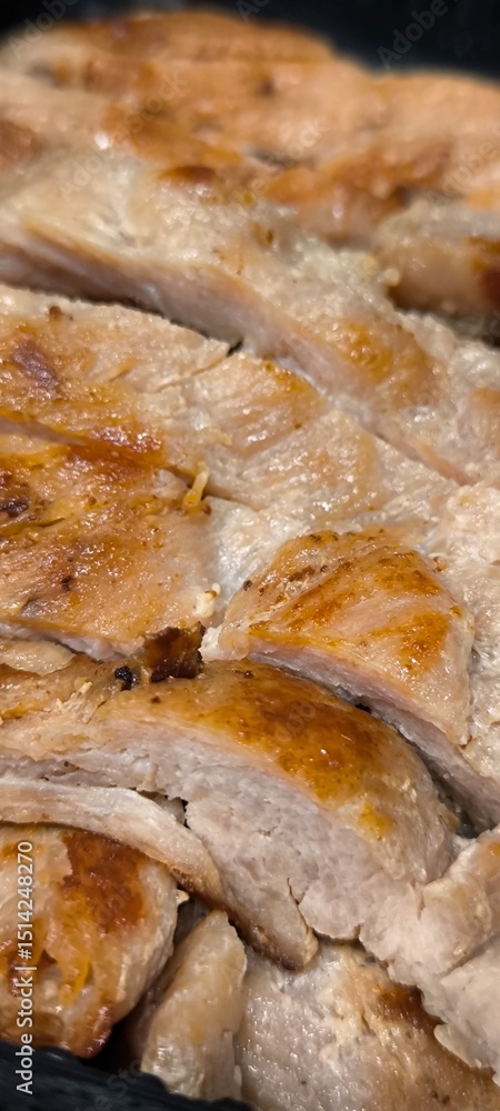 Charcoal-grilled pork in a black container Charcoal-grilled pork in a black container