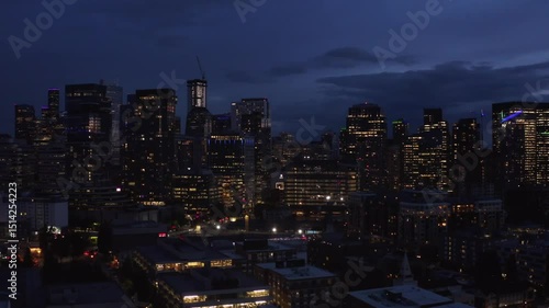 Wallpaper Mural Cityscape at twilight: Illuminated skyscrapers under a tranquil, dark sky Torontodigital.ca