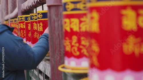 Close-up of many Tibetan prayer wheels spinning in slow motion, mongolia