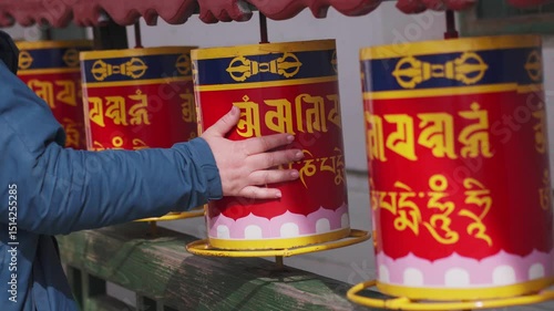 Close-up of many Tibetan prayer wheels spinning in slow motion, mongolia