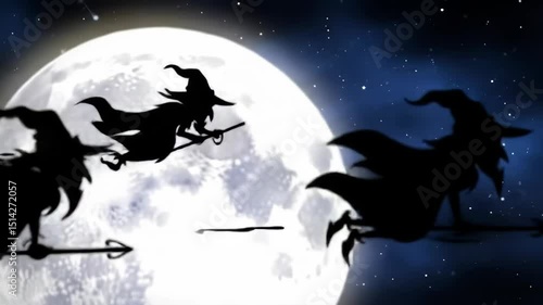Silhouettes of witches flying over full moon