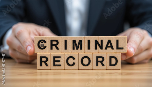 Businessman holding colorful blocks sees inscription CRIMINAL RECORD. Concept of criminal records